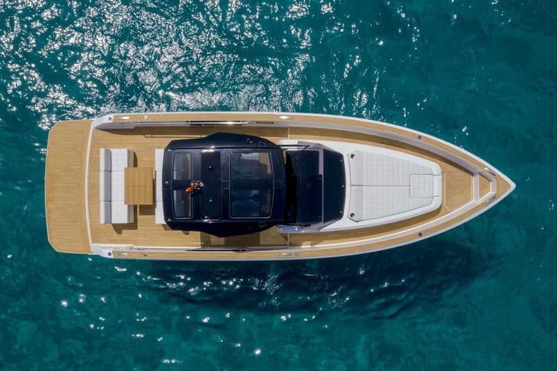 Bird eye view of a boat. Sunny day and turquoise waters.