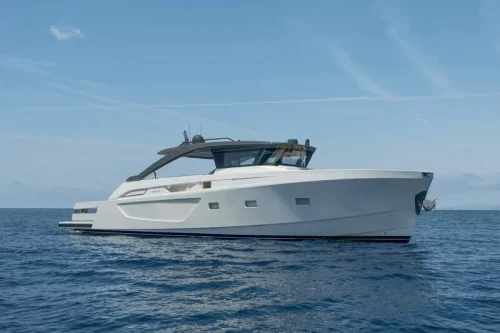 yacht anchored at a bay in Mallorca. New boat from 2024. Spacious yacht. Sunny day. Blue water.