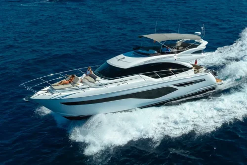 Yacht in charter in Mallorca navigating. Sunny day. People are sunbathing.