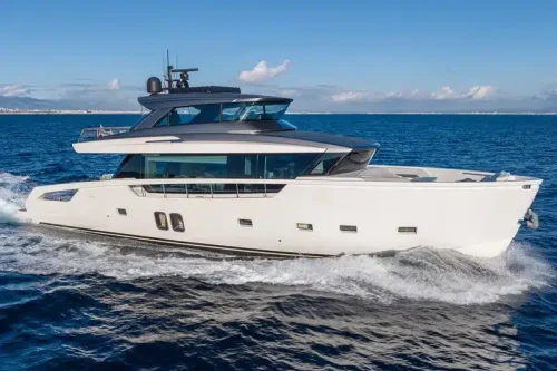yacht in charter in Mallorca navigating. White yacht. Sunny day and blue ocean.